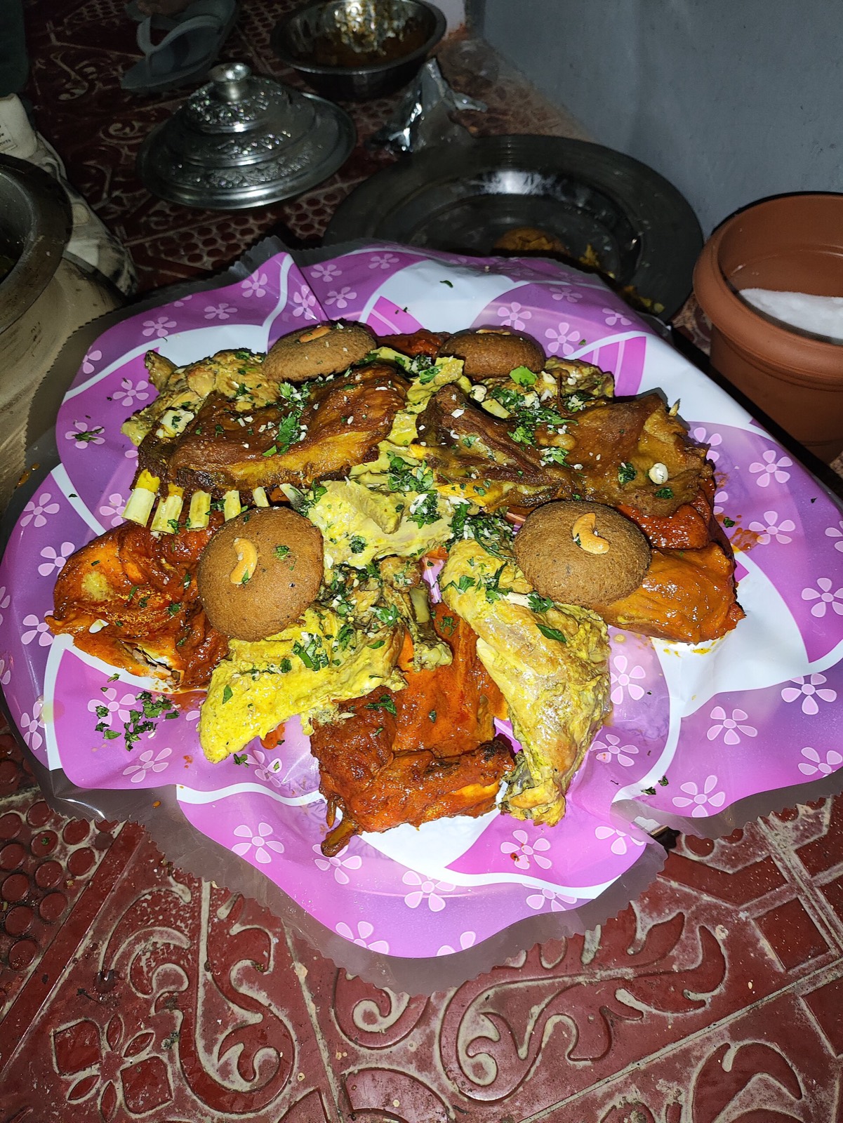 A traditional Kashmiri Wazwan platter with assorted meat dishes