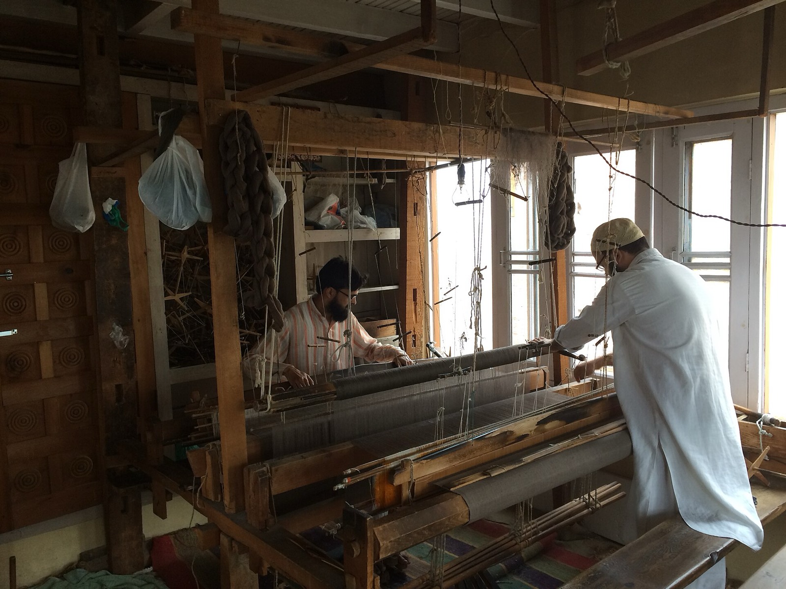 Artisans weaving Pashmina on a traditional handloom in Srinagar